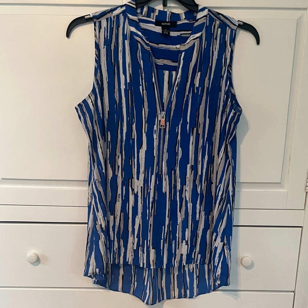 Sleeveless Top, very slimming, and flattering on.
